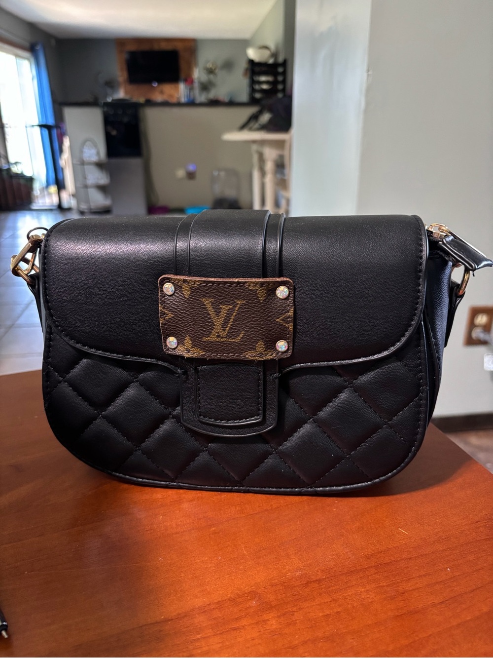 Black Quilted Shoulder Bag with Monogram Accent